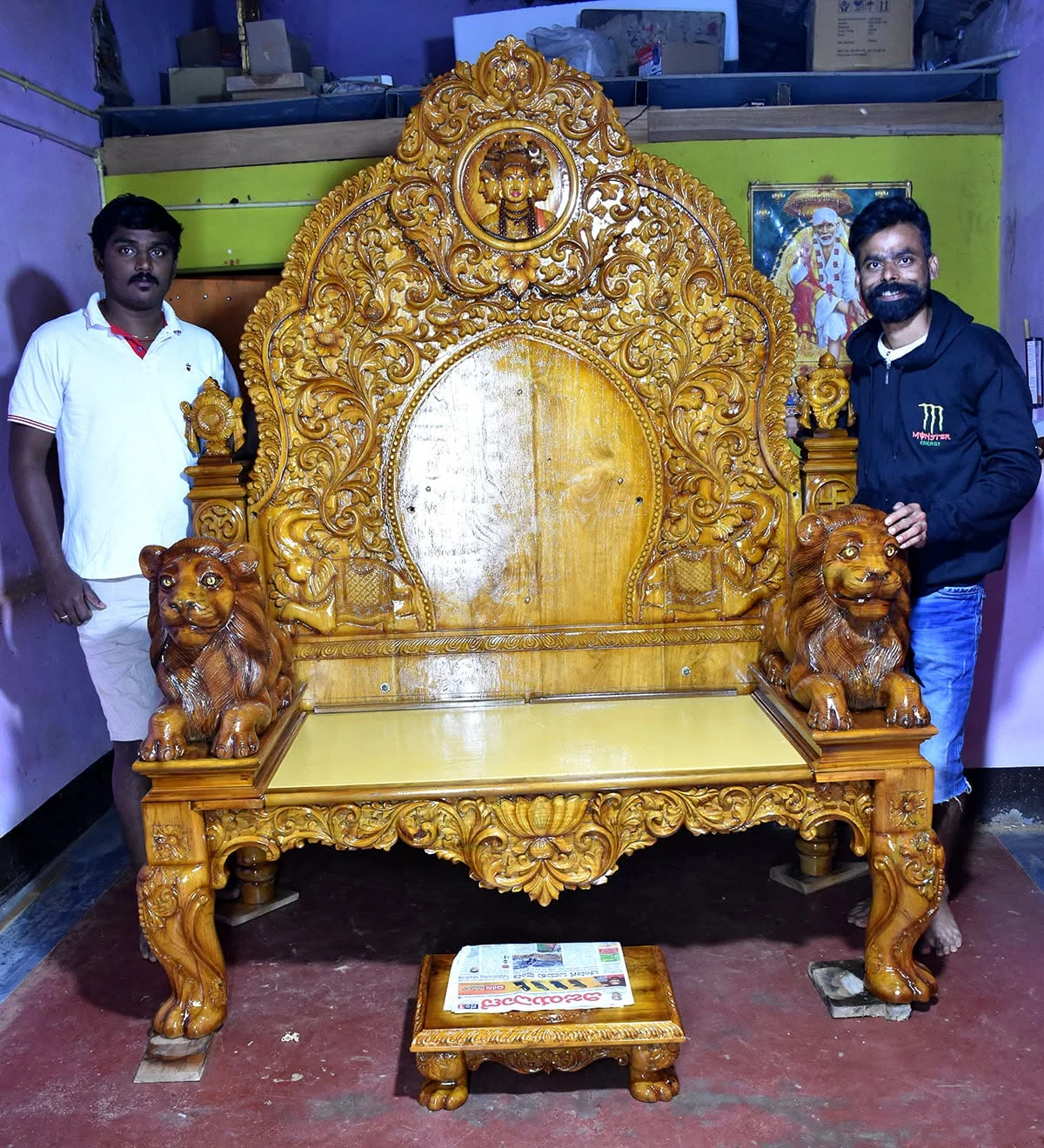 Wooden simhasana (deity throne) with carved back panel and lion-motif arms — piece 06 of the collection