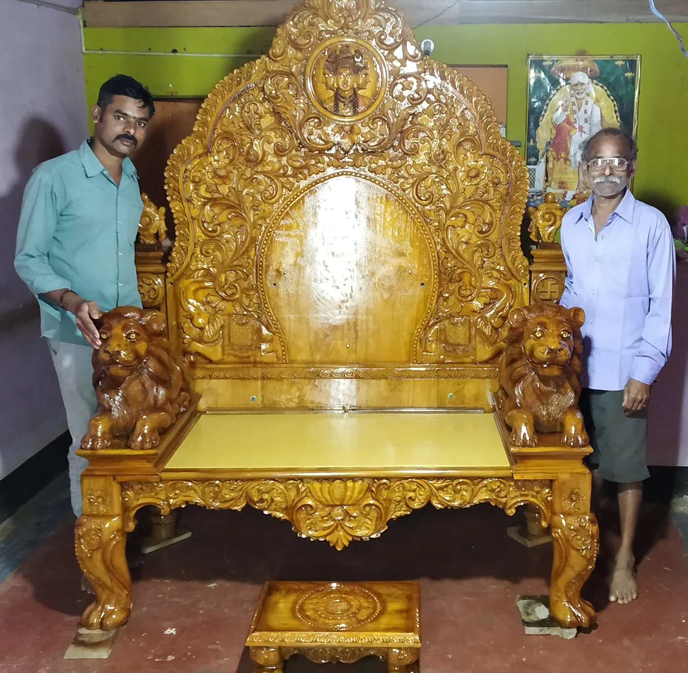 Wooden simhasana (deity throne) with carved back panel and lion-motif arms