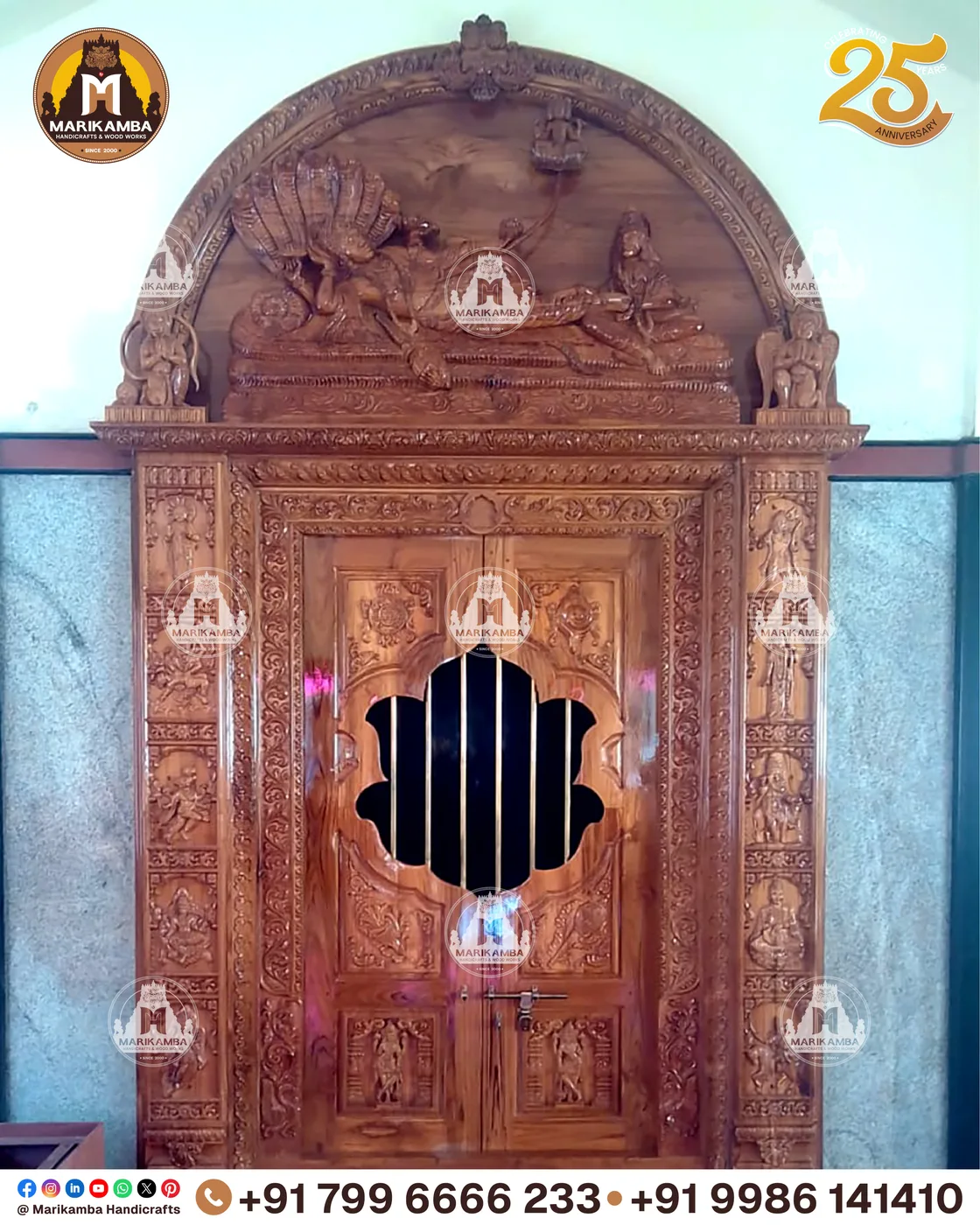 Traditional Karnataka-style carved door frame with guardian figures at the jambs