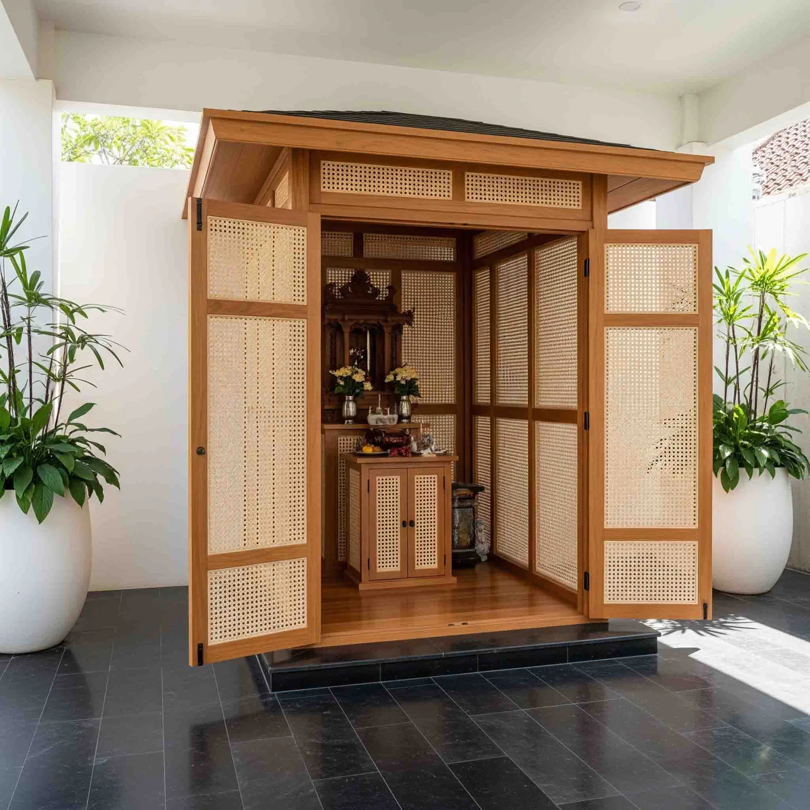 Wooden mandir design reference showing carved pillars, arch and base storage (reference 29)