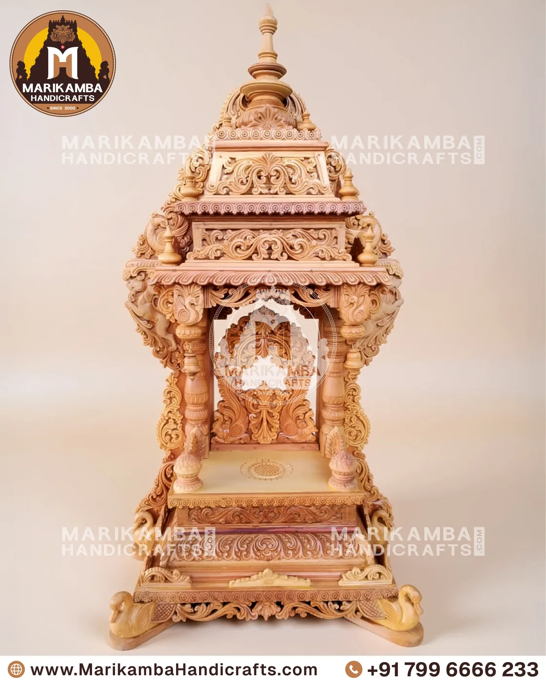 Compact wooden pooja unit with carved doors, drawers and a bell-motif valance — piece 86 of the collection