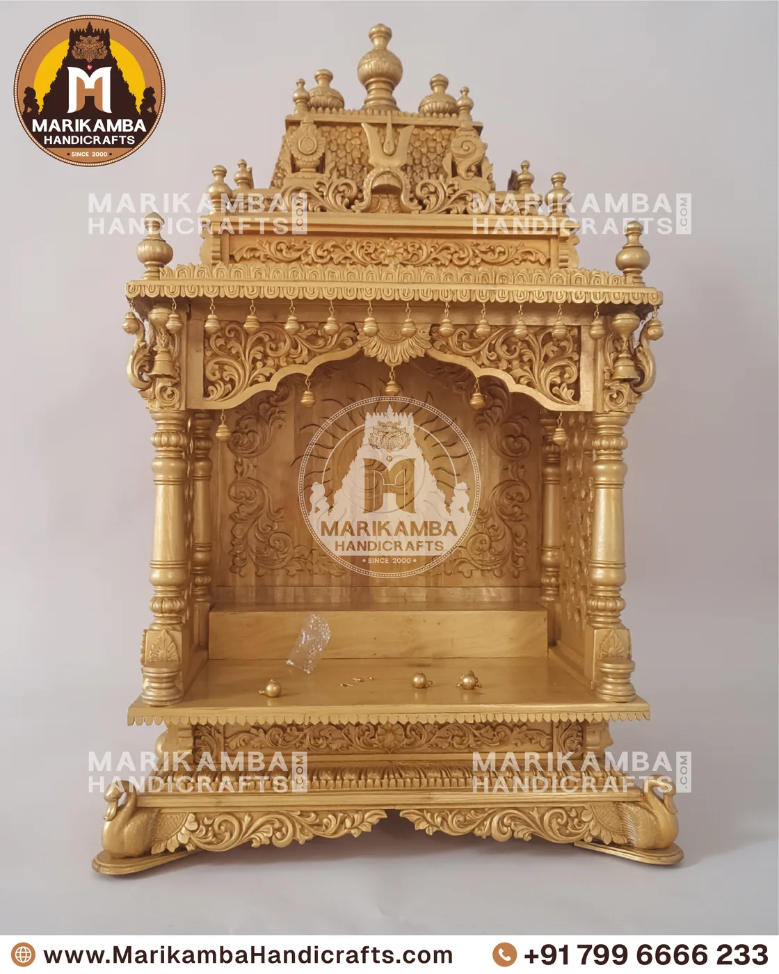 Carved teak pooja mandira finished in a warm natural sheen, ready for installation — piece 120 of the collection