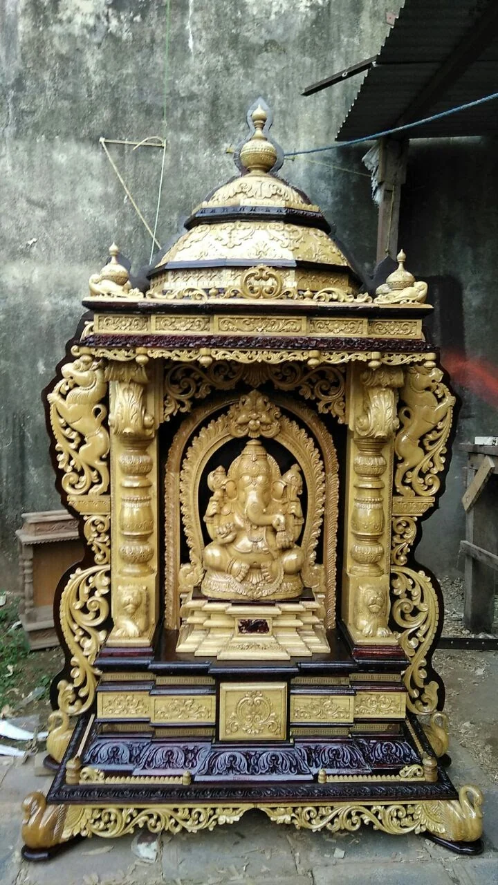 Wooden deity idol with carved crown, jewellery and pedestal