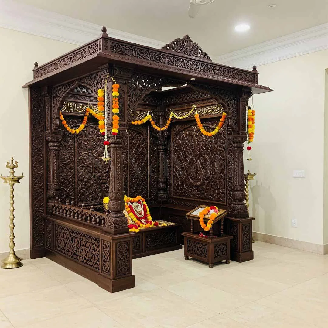Carved wooden pooja unit design reference with panelled doors and a deity niche (reference 16)
