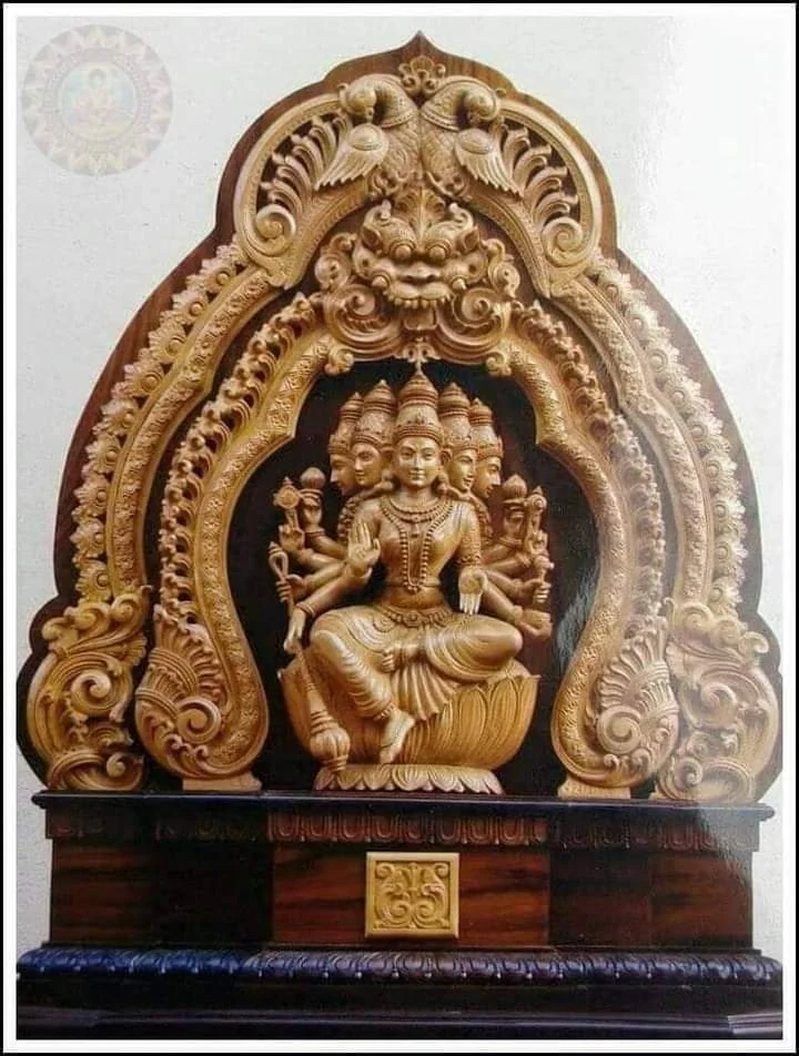 Wooden idol carved in the round, with detailed drapery and ornament — piece 10 of the collection