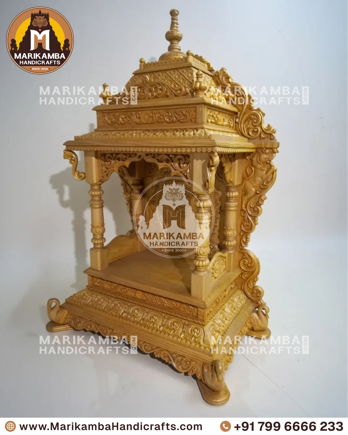Carved teak pooja mandira finished in a warm natural sheen, ready for installation — piece 100 of the collection